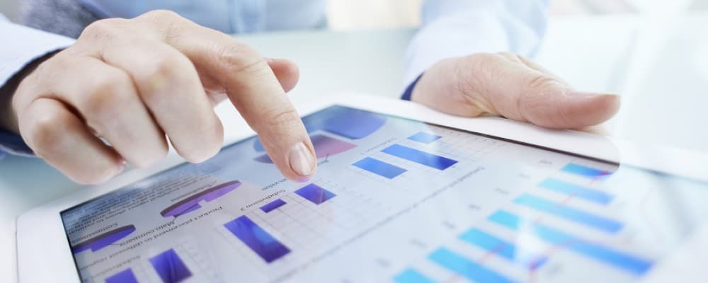 A professional interacting with a tablet.